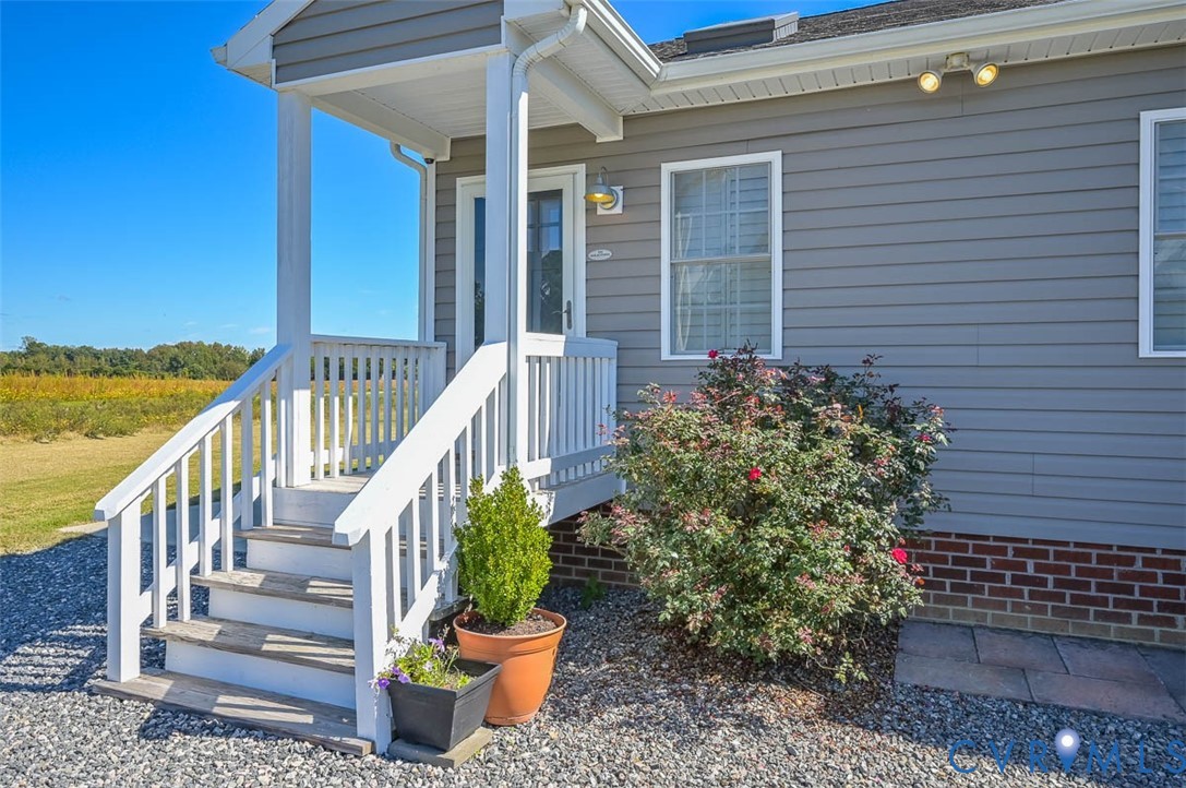 8441 Buffin Road Henrico, VA 23231 - Photo 46 of 50 a view of a balcony with wooden floor and potted plants