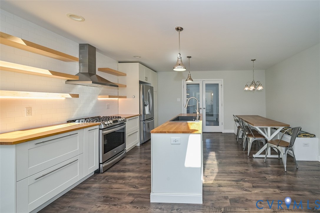 8441 Buffin Road Henrico, VA 23231 - Photo 5 of 50 a kitchen with stainless steel appliances granite countertop a stove and a wooden floors