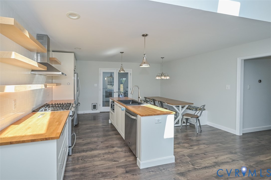 8441 Buffin Road Henrico, VA 23231 - Photo 6 of 50 a large kitchen with a table and chairs