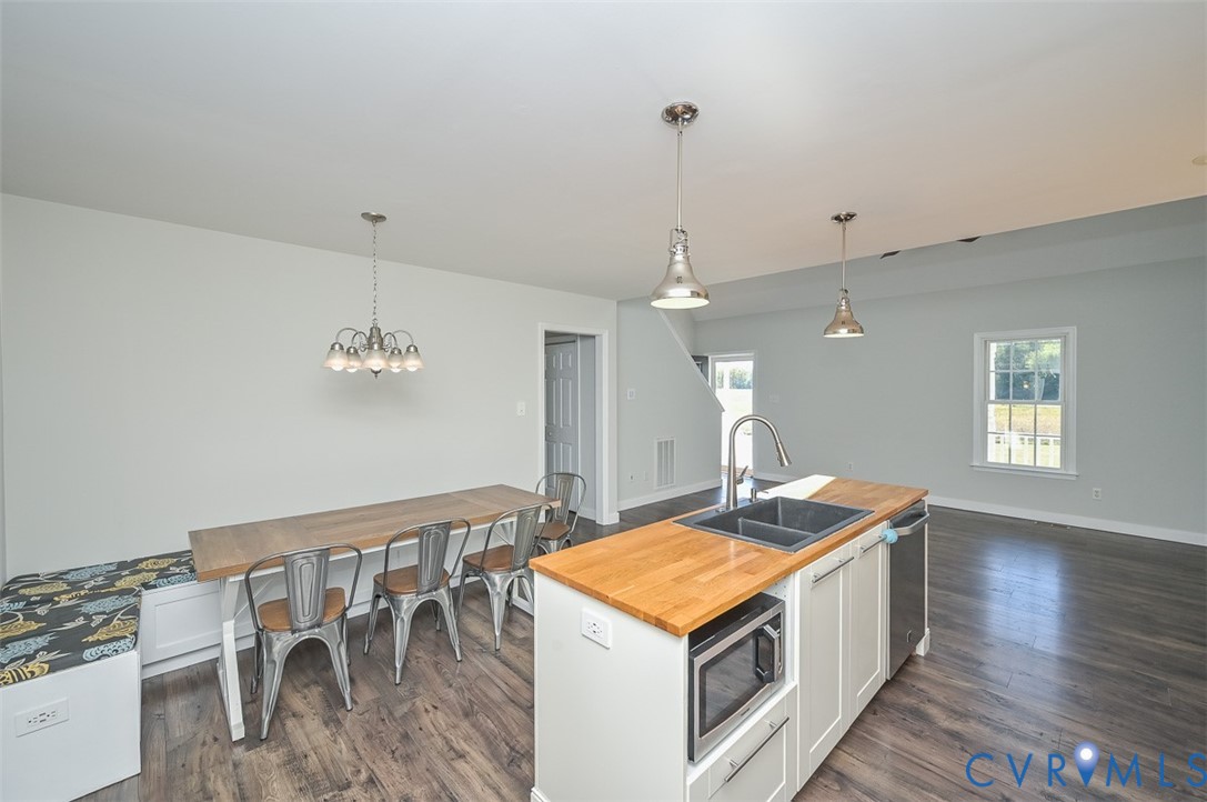 8441 Buffin Road Henrico, VA 23231 - Photo 7 of 50 a kitchen that has a table and chairs in it