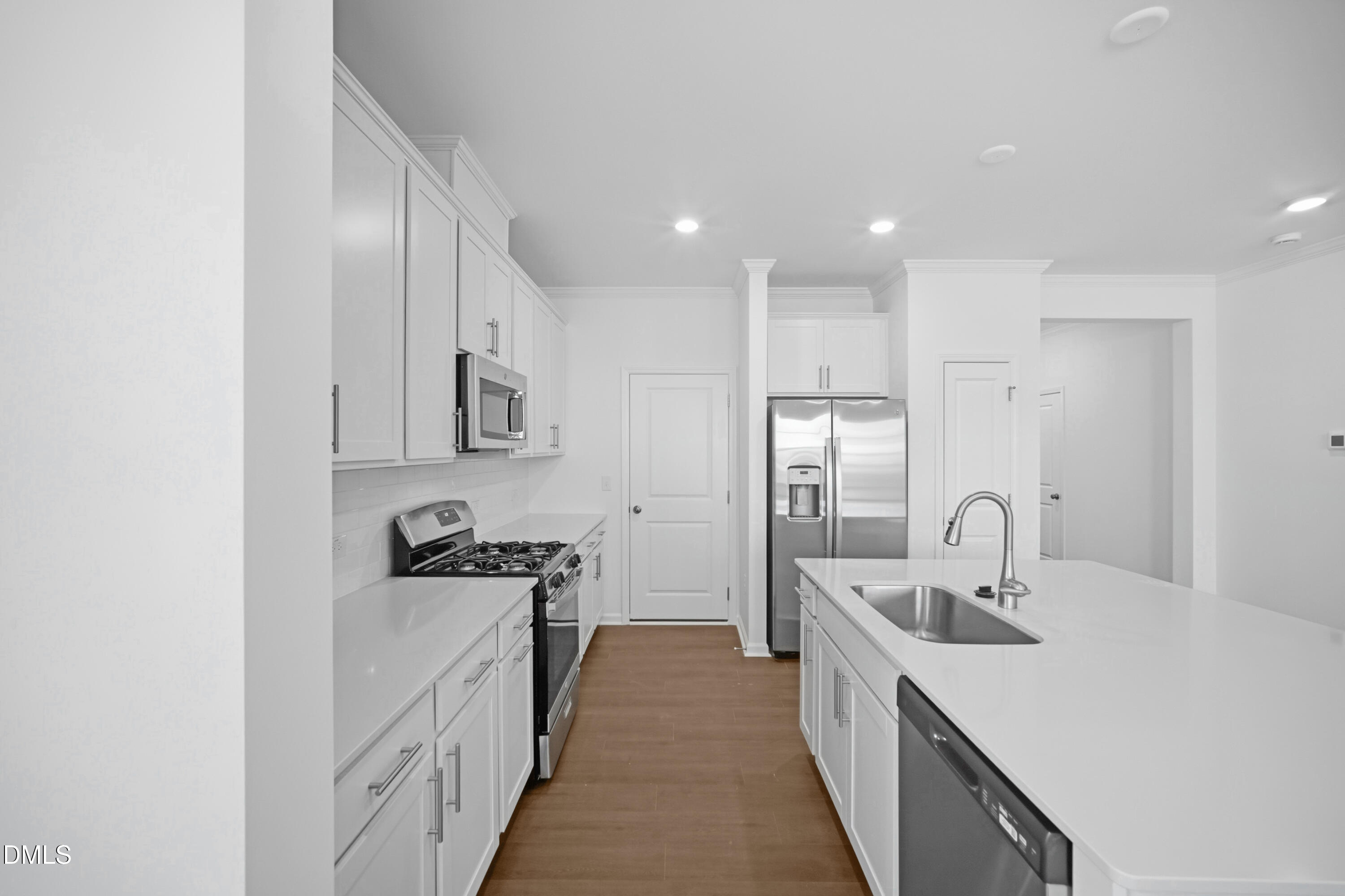 2921 Hickory Fld Drive Raleigh, NC 27616 - Photo 11 of 30 a kitchen with kitchen island a sink appliances and cabinets