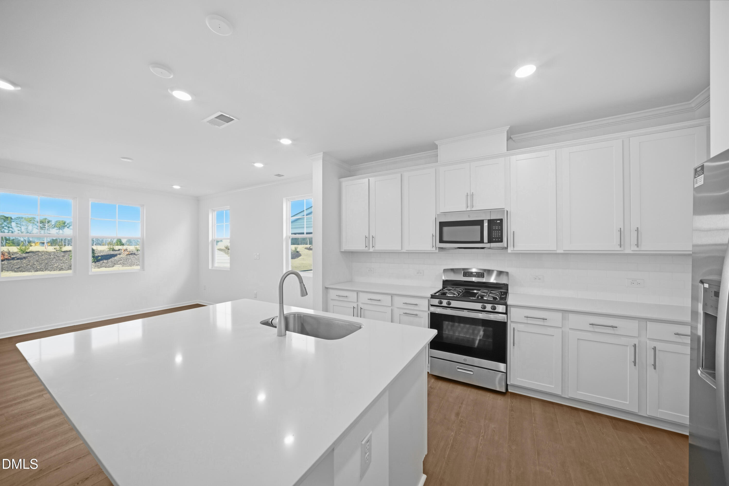 2921 Hickory Fld Drive Raleigh, NC 27616 - Photo 13 of 30 a kitchen with stainless steel appliances and white cabinets