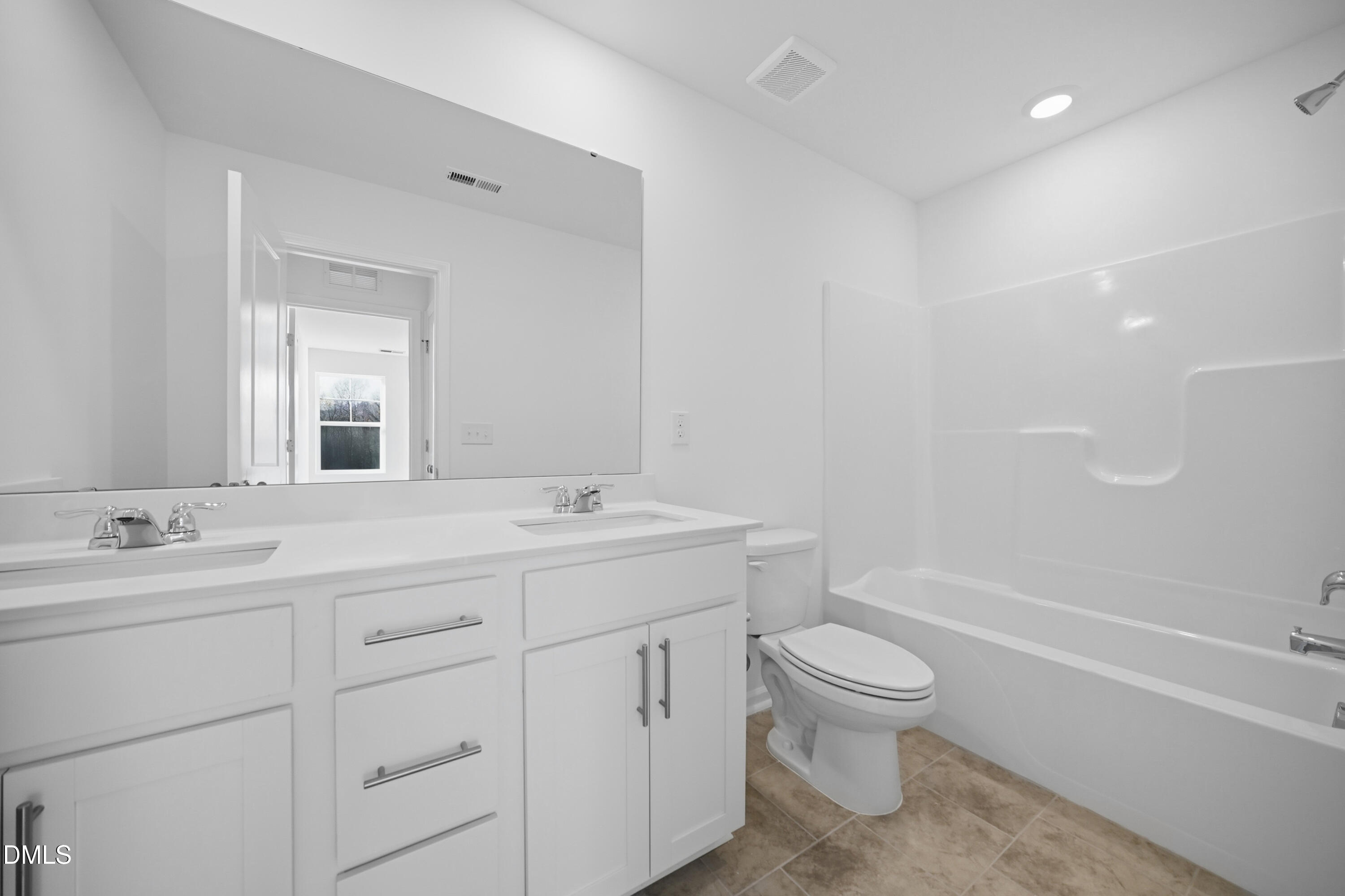 2921 Hickory Fld Drive Raleigh, NC 27616 - Photo 14 of 30 a bathroom with a toilet a sink a mirror a bathtub and vanity