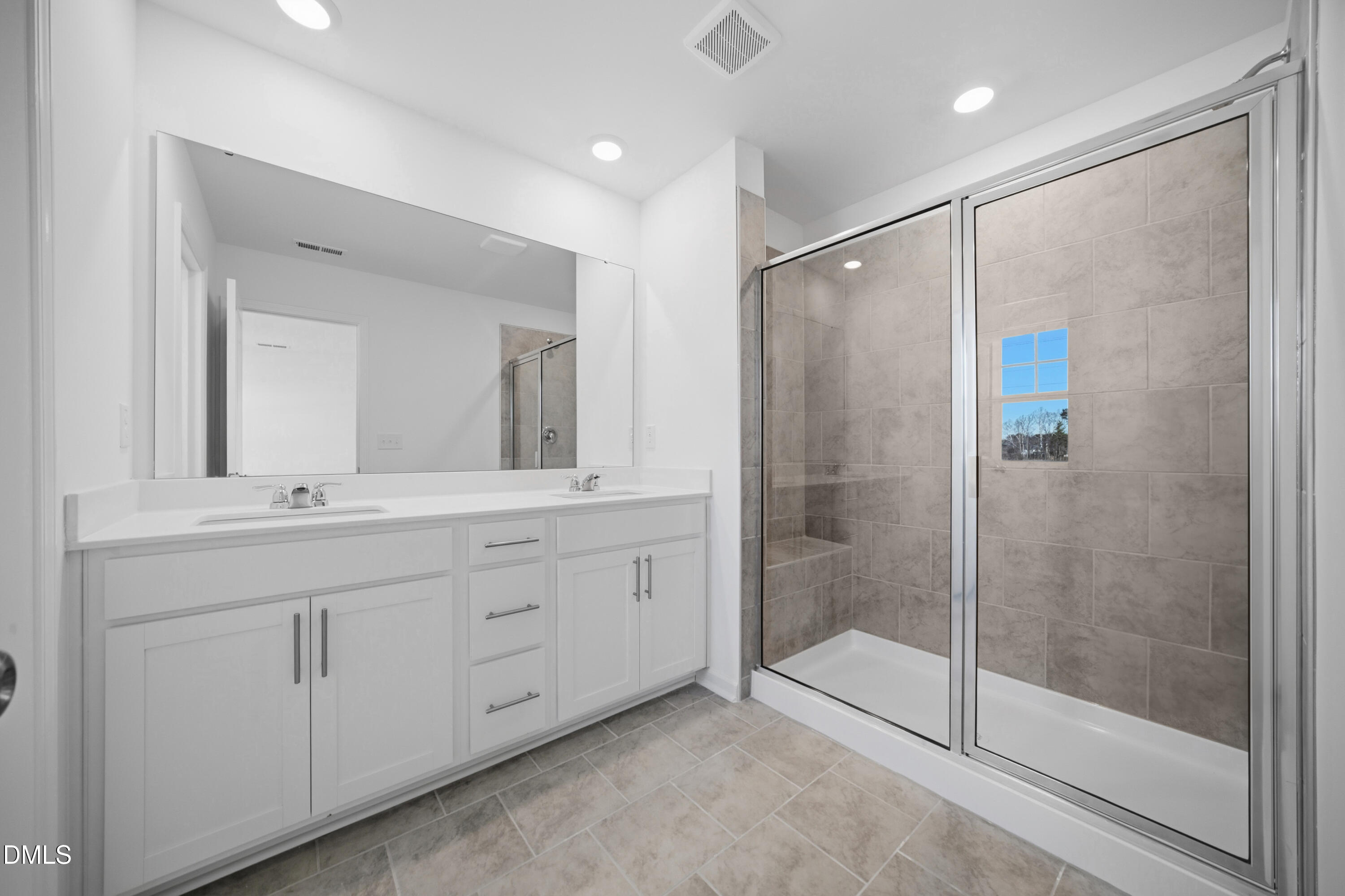 2921 Hickory Fld Drive Raleigh, NC 27616 - Photo 27 of 30 a bathroom with a shower sink and mirror