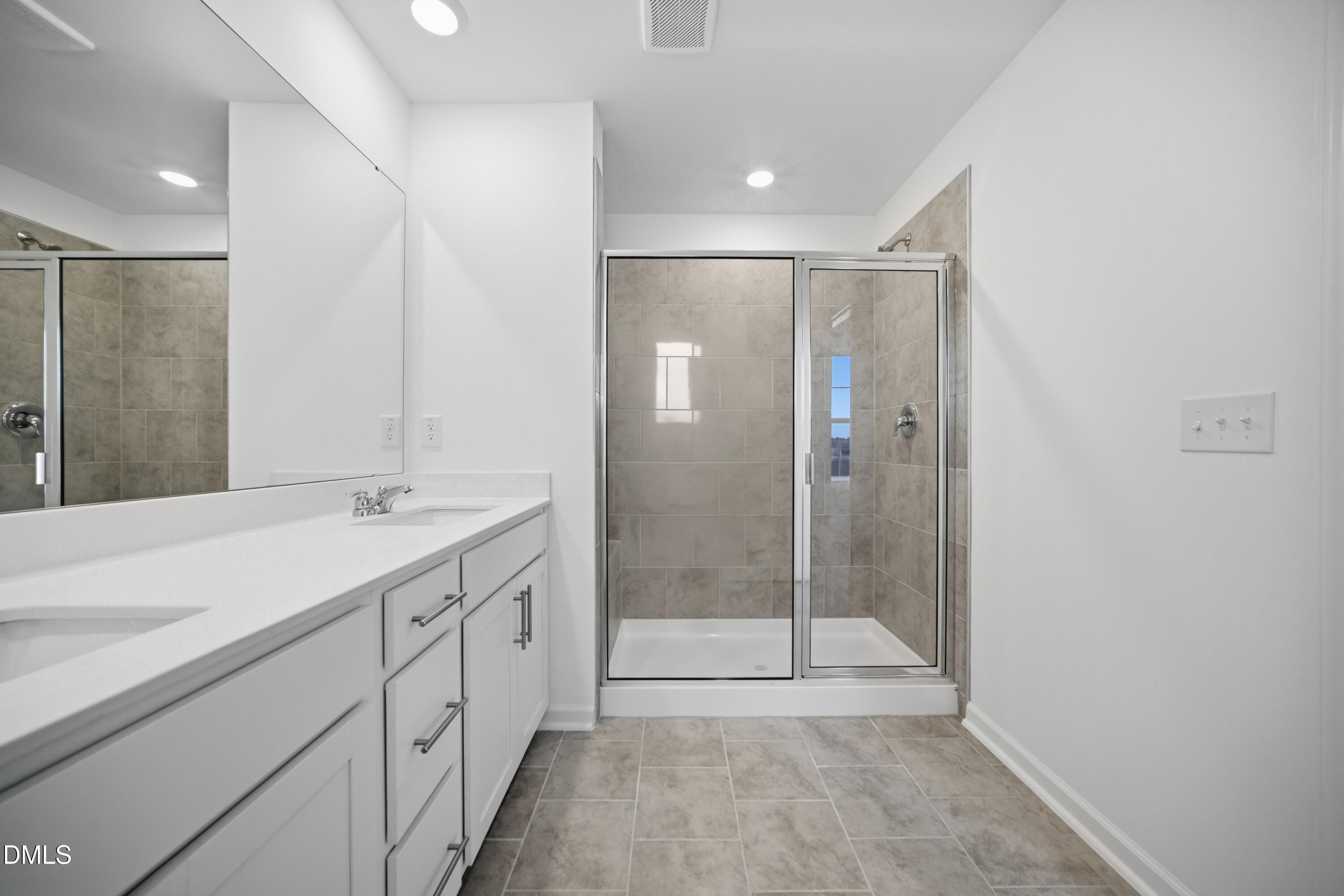 2921 Hickory Fld Drive Raleigh, NC 27616 - Photo 28 of 30 a bathroom with a shower sink and mirror