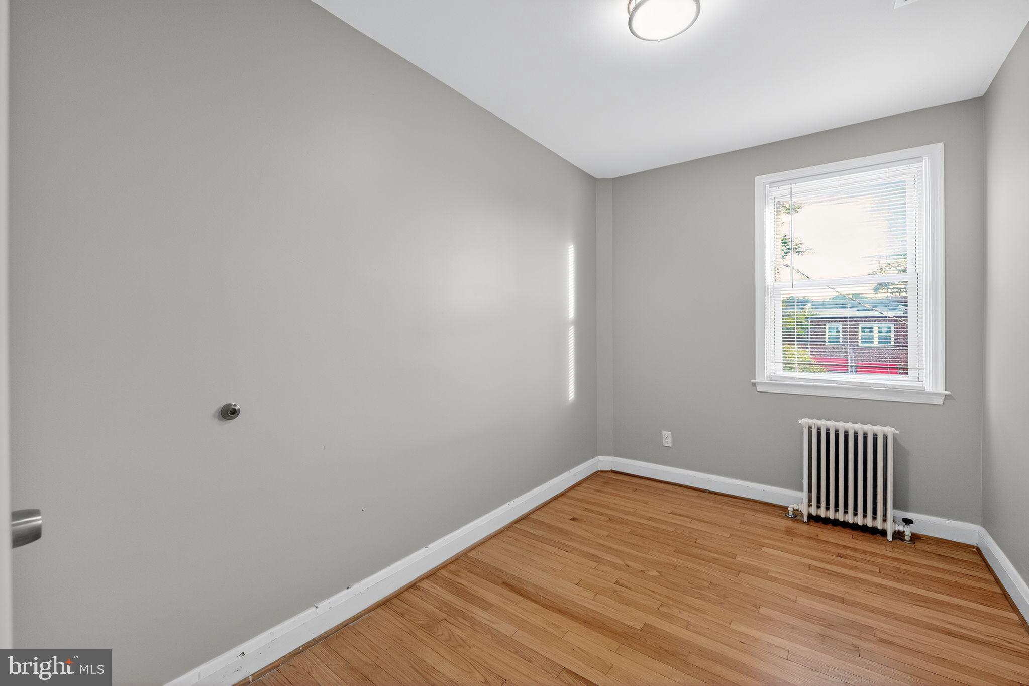 1017 Wicklow Road Baltimore, MD 21229 - Photo 12 of 34 a view of a room with wooden floor and windows
