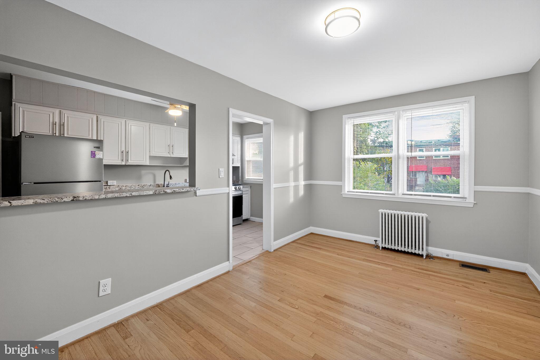 1017 Wicklow Road Baltimore, MD 21229 - Photo 13 of 34 a view of kitchen with wooden floor and electronic appliances