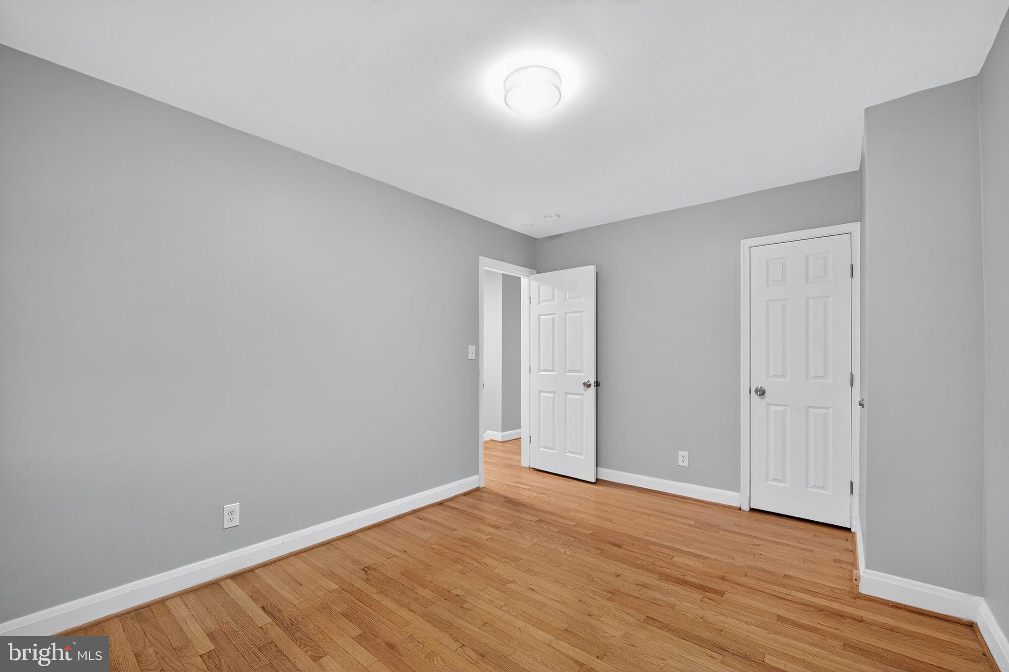 1017 Wicklow Road Baltimore, MD 21229 - Photo 21 of 34 a view of an empty room with wooden floor