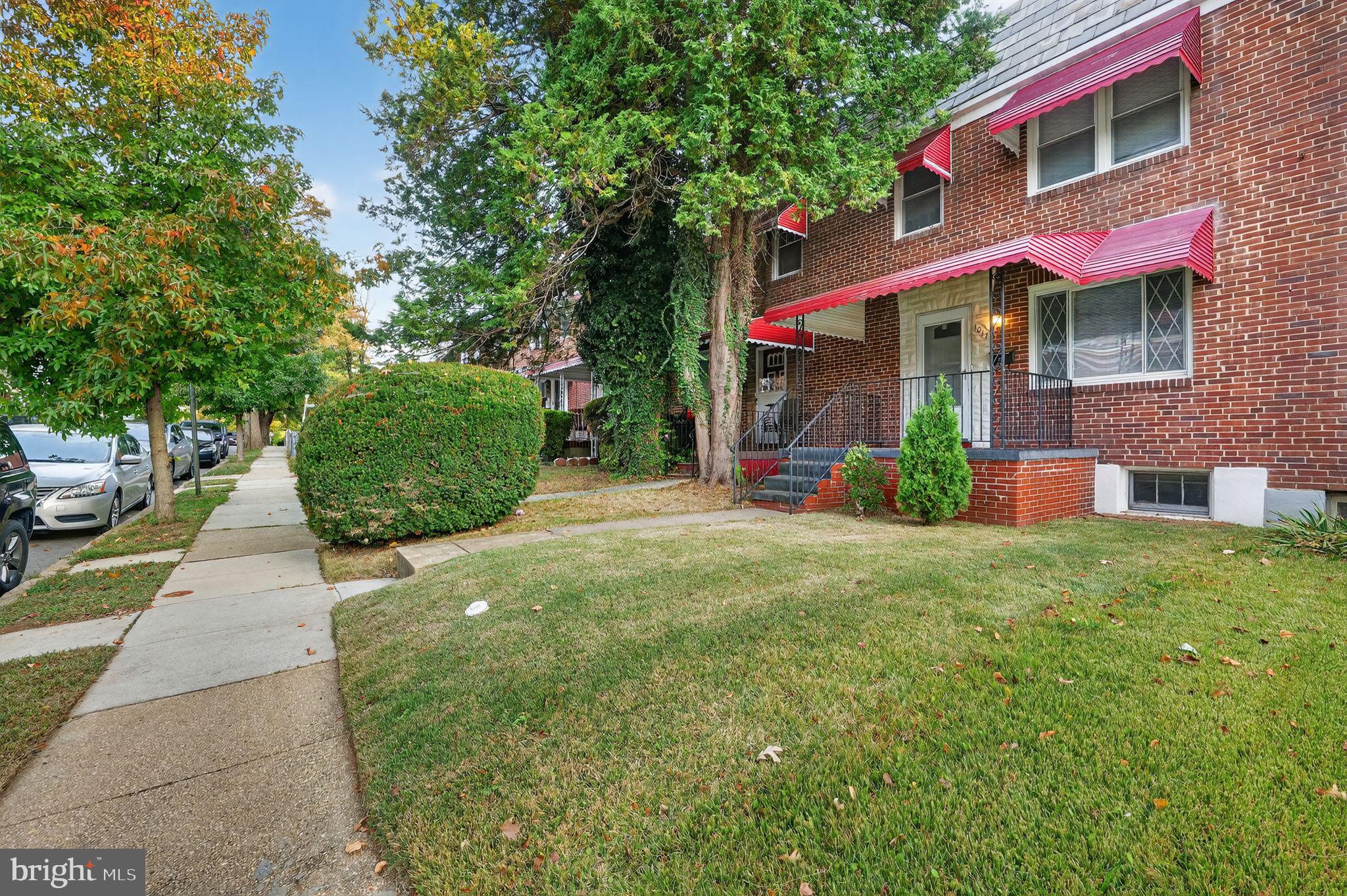 1017 Wicklow Road Baltimore, MD 21229 - Photo 3 of 34 a front view of a house with garden