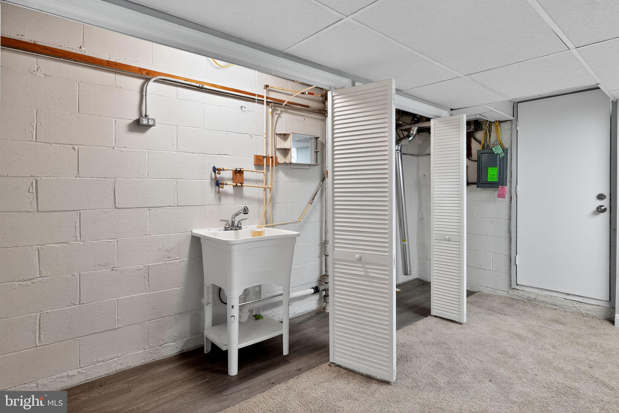1017 Wicklow Road Baltimore, MD 21229 - Photo 32 of 34 a bathroom with a sink and a mirror