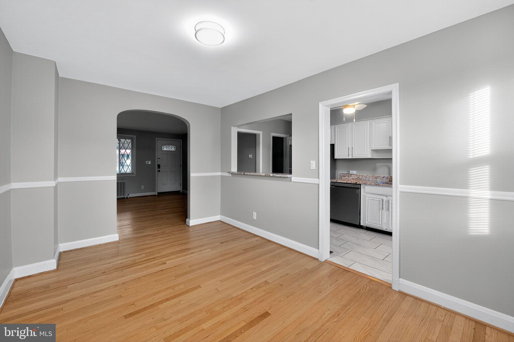 1017 Wicklow Road Baltimore, MD 21229 - Photo 7 of 34 a view of kitchen with wooden floor and electronic appliances