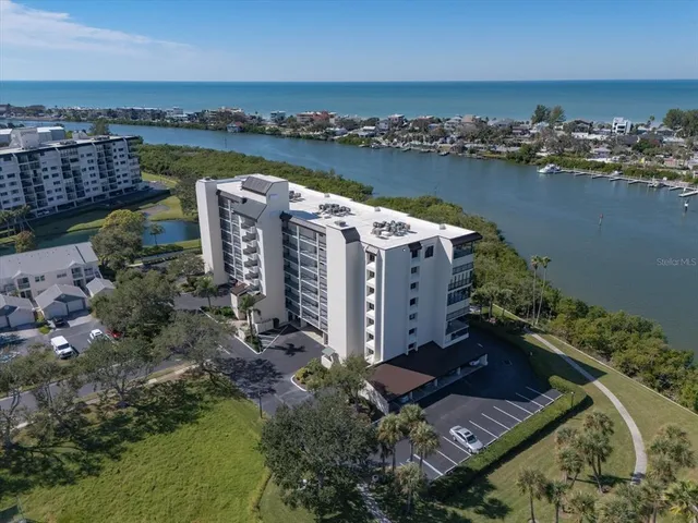 an aerial view of a house with a ocean view