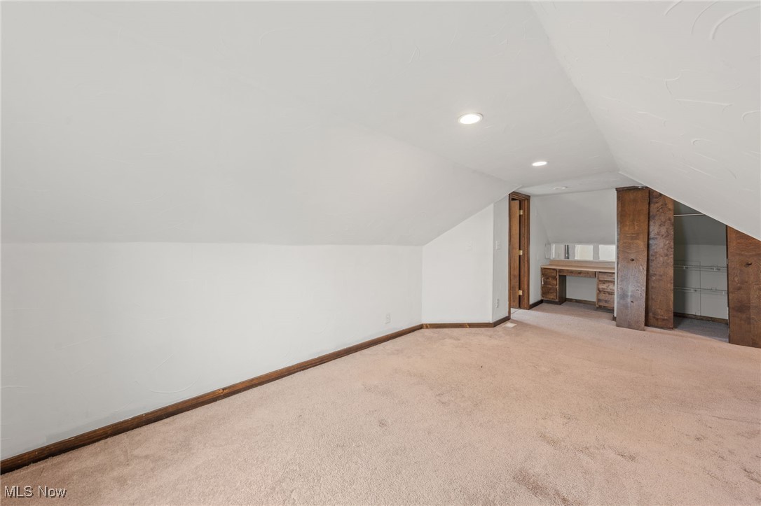 4146 Wyncote Road South Euclid, OH 44121 - Photo 17 of 20 Additional living space with baseboards, lofted ceiling, recessed lighting, and carpet flooring