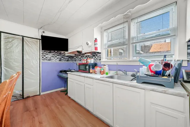 a kitchen with stainless steel appliances a sink stove and refrigerator