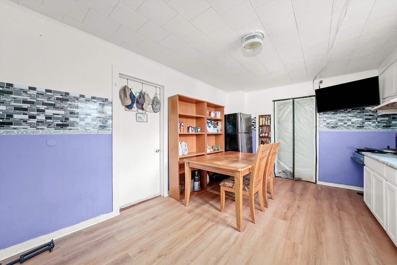4943 South Marshfield Avenue Chicago, IL 60609 - Photo 20 of 36 a view of a dining room with furniture and wooden floor