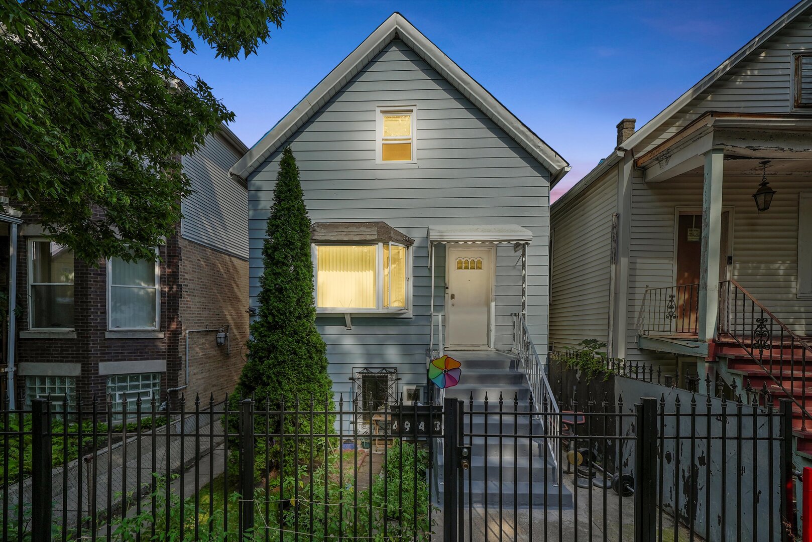 4943 South Marshfield Avenue Chicago, IL 60609 - Photo 2 of 36 a front view of house along with street