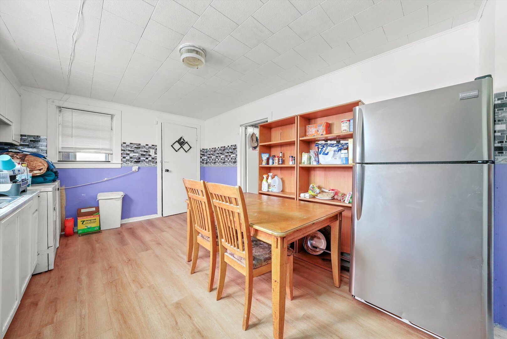4943 South Marshfield Avenue Chicago, IL 60609 - Photo 21 of 36 a dining room with furniture and wooden floor