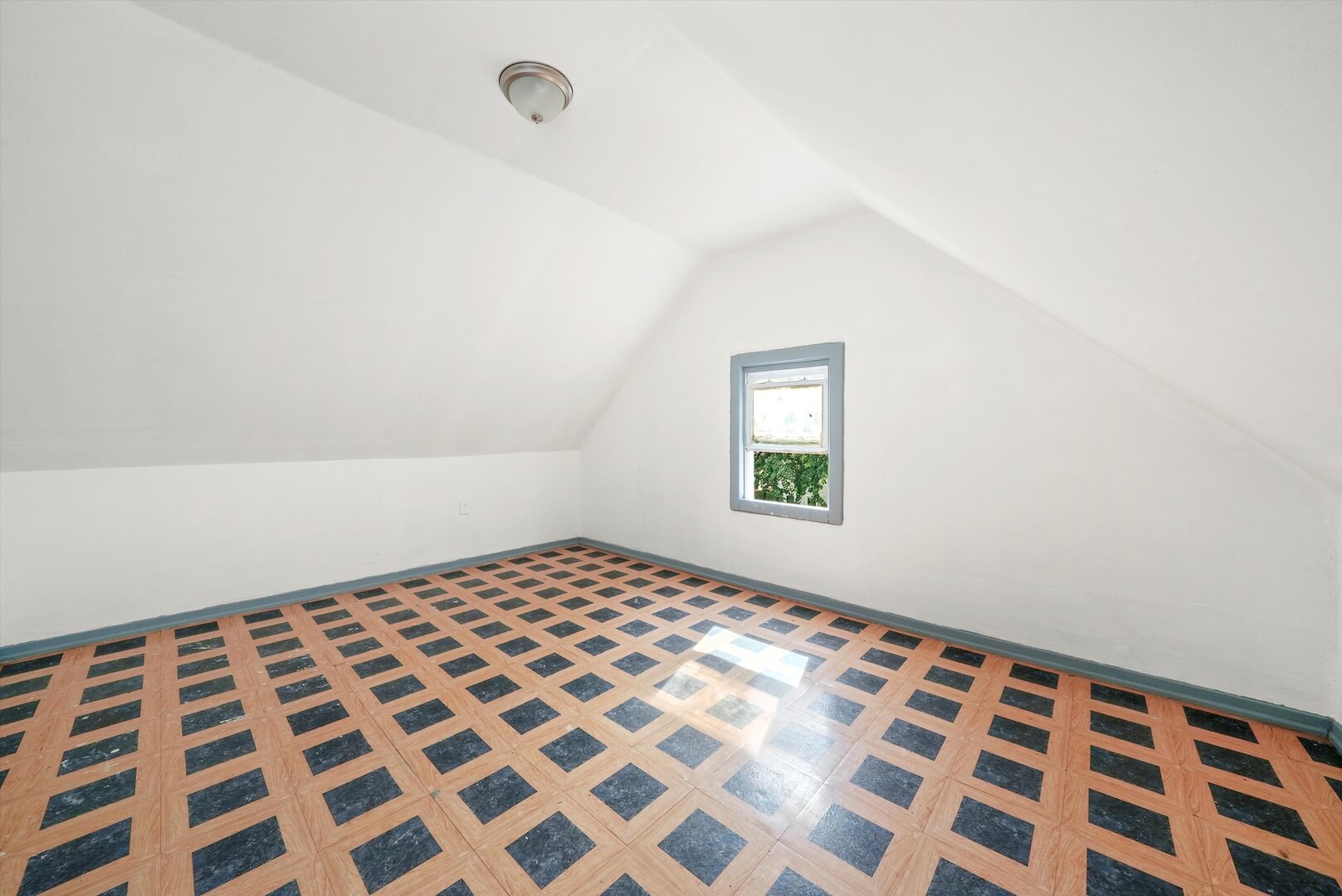 4943 South Marshfield Avenue Chicago, IL 60609 - Photo 22 of 36 a bedroom with a bed and a window