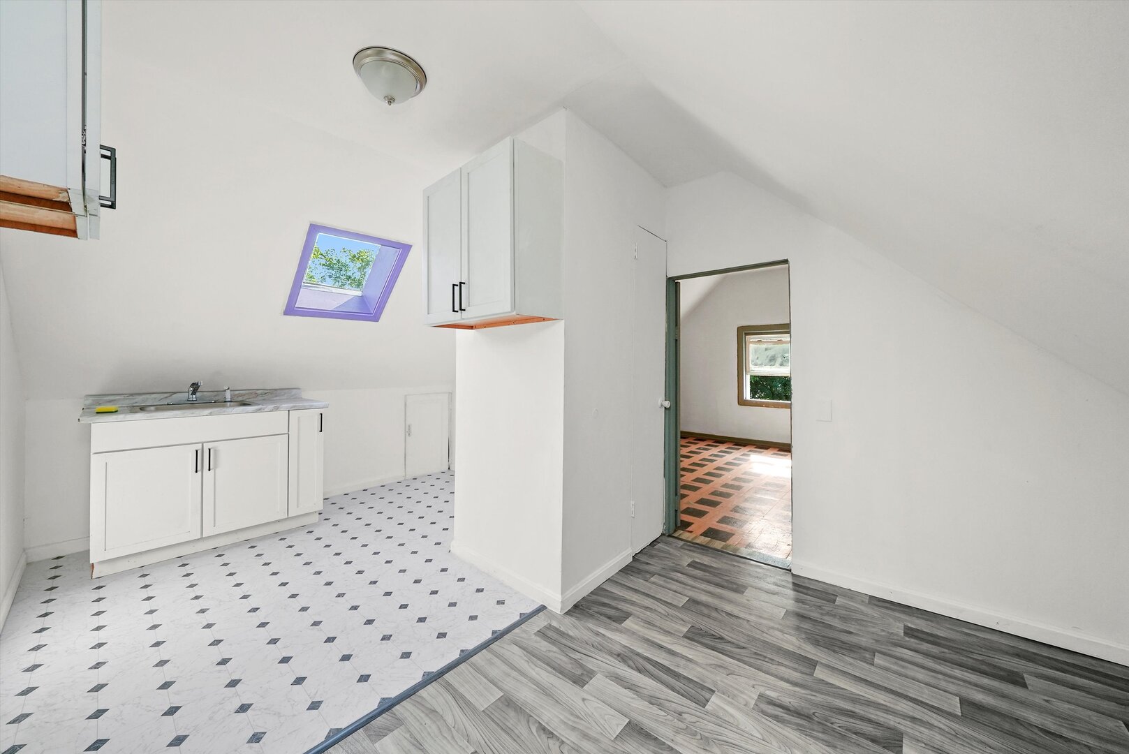 4943 South Marshfield Avenue Chicago, IL 60609 - Photo 23 of 36 a bathroom with a sink a toilet and a window