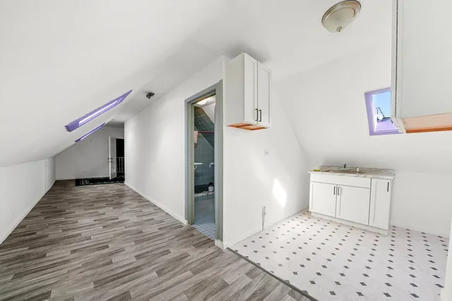 a bedroom with a bed and cabinets