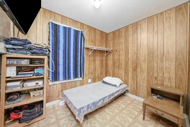 a bedroom with a bed and a cabinets