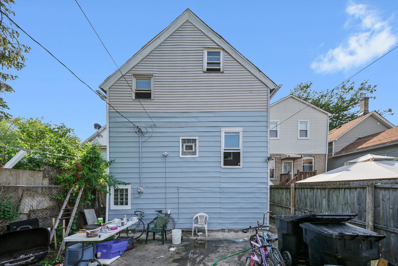 4943 South Marshfield Avenue Chicago, IL 60609 - Photo 35 of 36 a view of a house with a yard and furniture