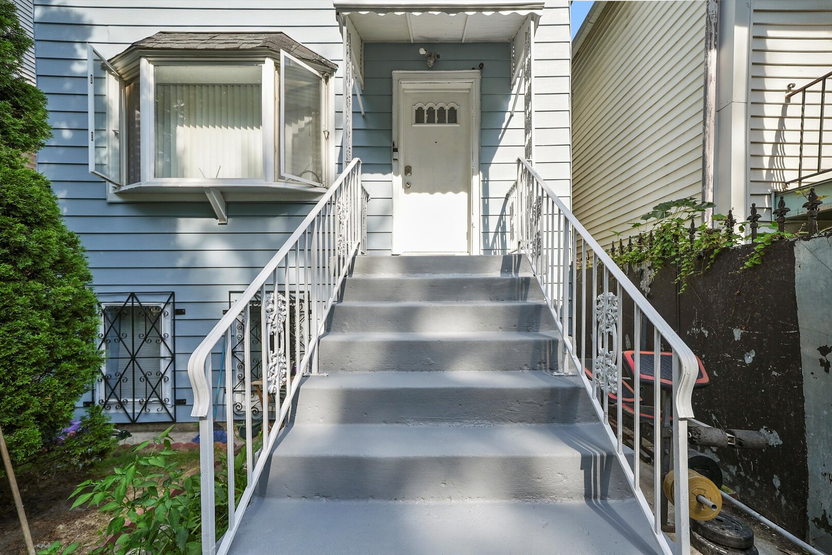4943 South Marshfield Avenue Chicago, IL 60609 - Photo 4 of 36 a view of staircase with wooden floor and a potted plant