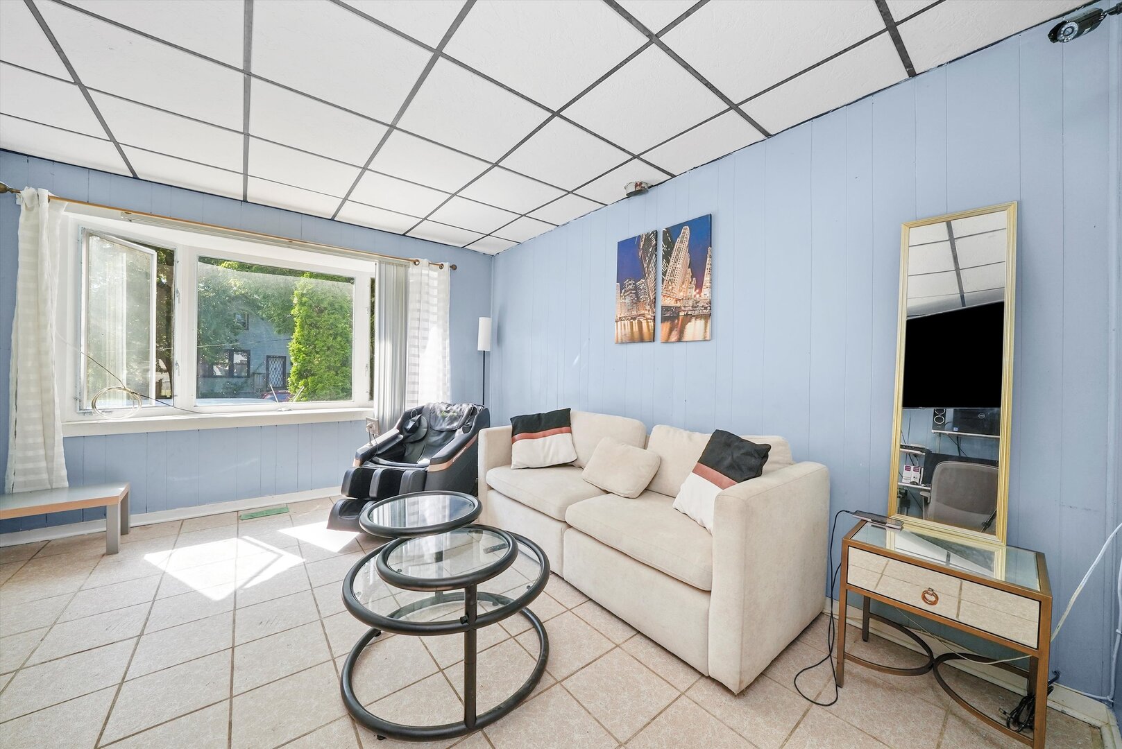4943 South Marshfield Avenue Chicago, IL 60609 - Photo 10 of 36 a living room with furniture and a flat screen tv