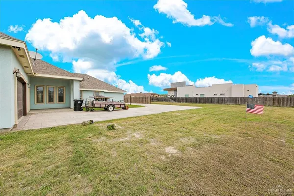a view of a house with a big yard