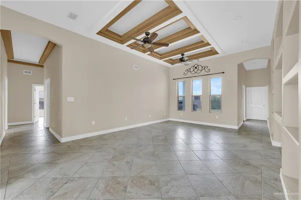 a view of an empty room with glass door