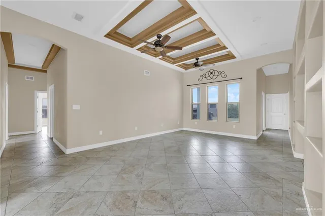 a view of an empty room with glass door