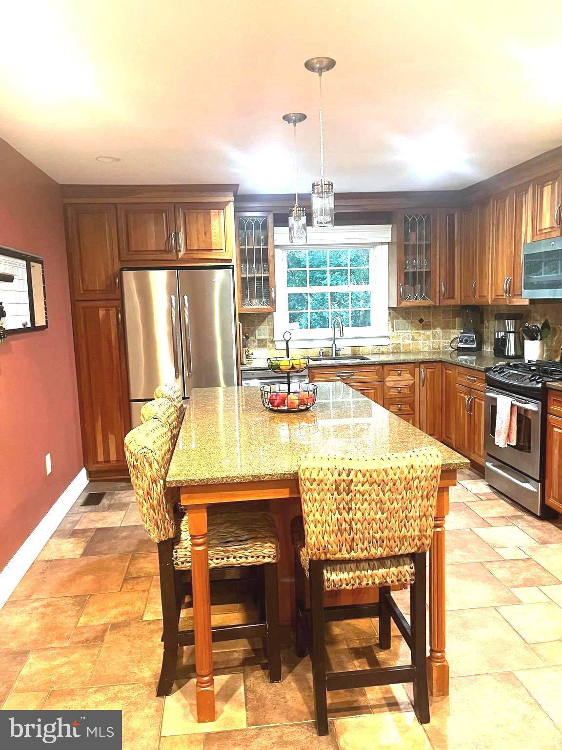 2802 Waterford Drive Cinnaminson, NJ 08077 - Photo 16 of 59 a dining table chair next to a window with kitchen view