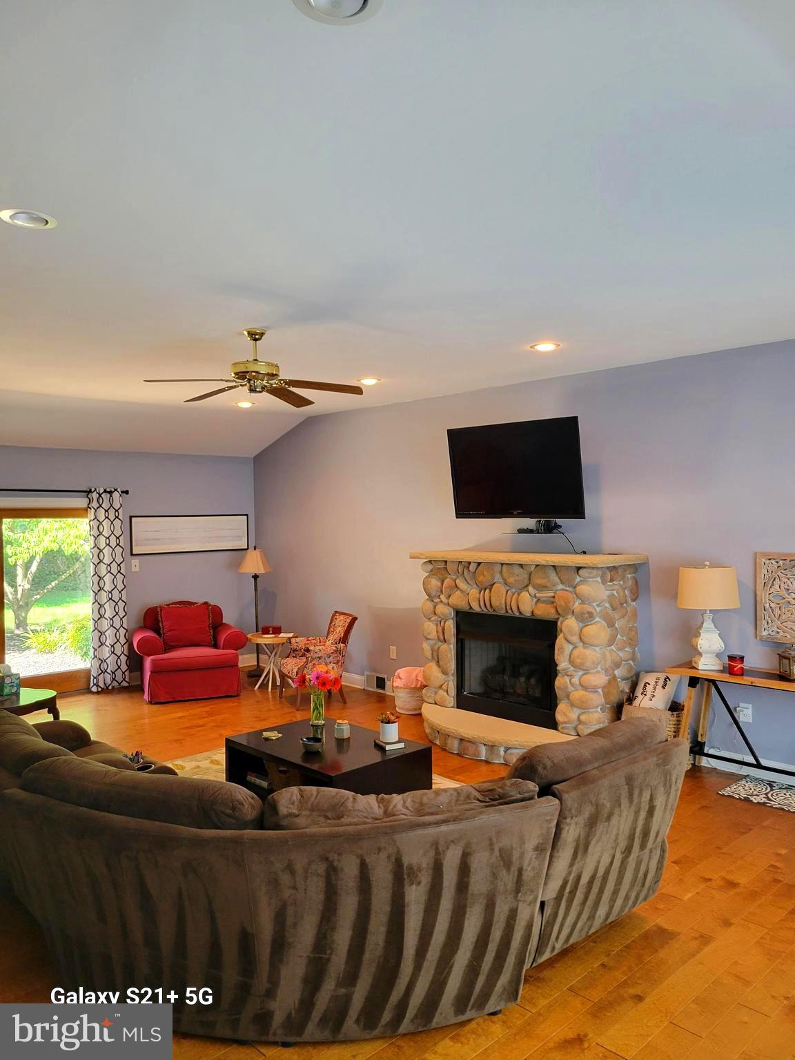 2802 Waterford Drive Cinnaminson, NJ 08077 - Photo 26 of 59 a living room with furniture a flat screen tv and a fireplace
