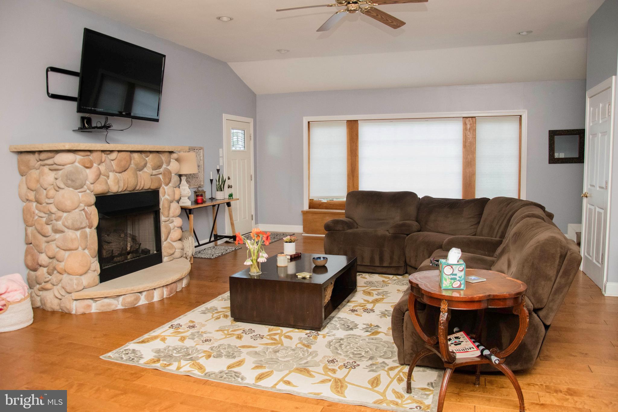 2802 Waterford Drive Cinnaminson, NJ 08077 - Photo 29 of 59 a living room with furniture a flat screen tv and a fireplace