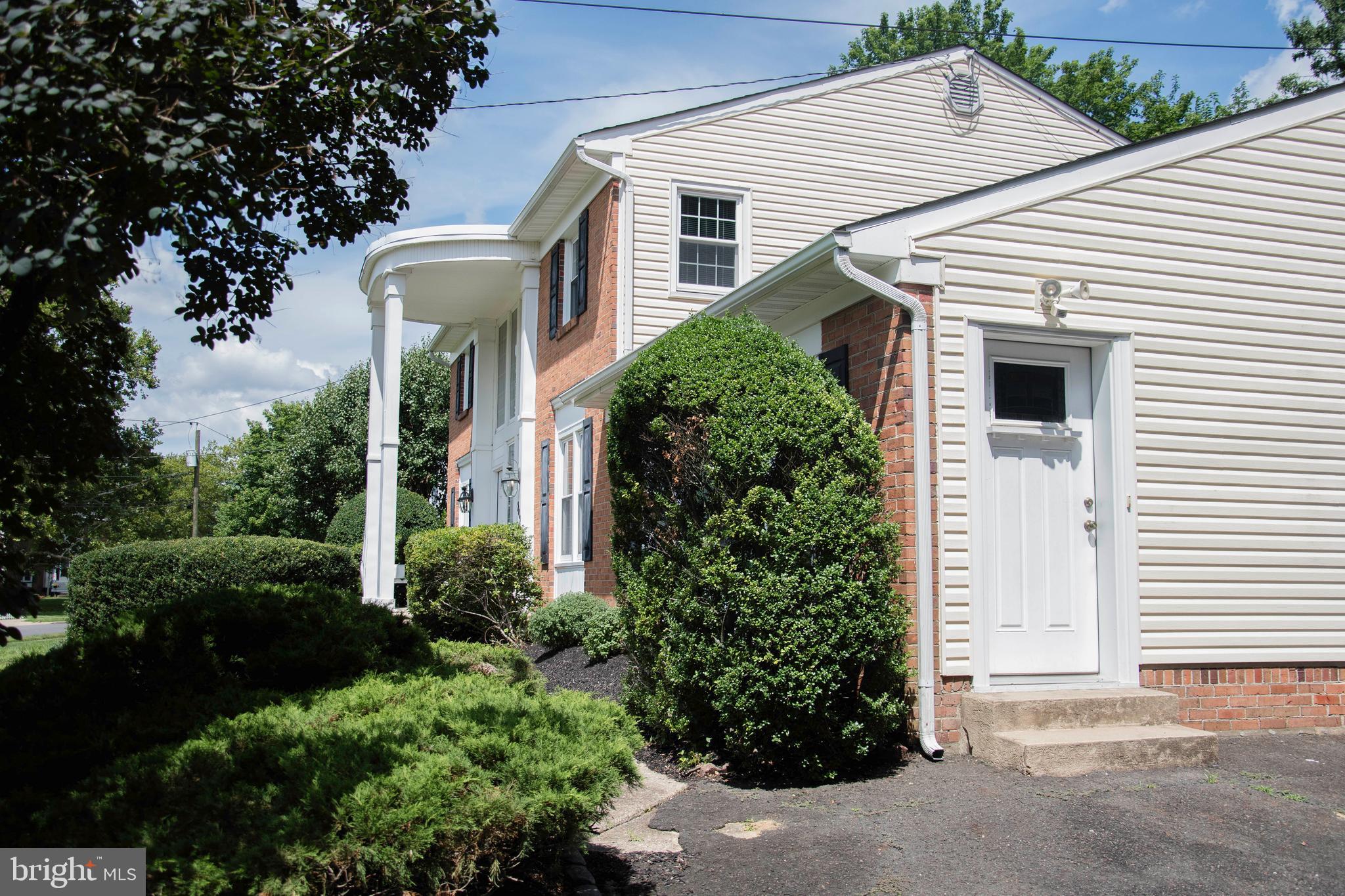 2802 Waterford Drive Cinnaminson, NJ 08077 - Photo 3 of 59 a front view of a house with a garden