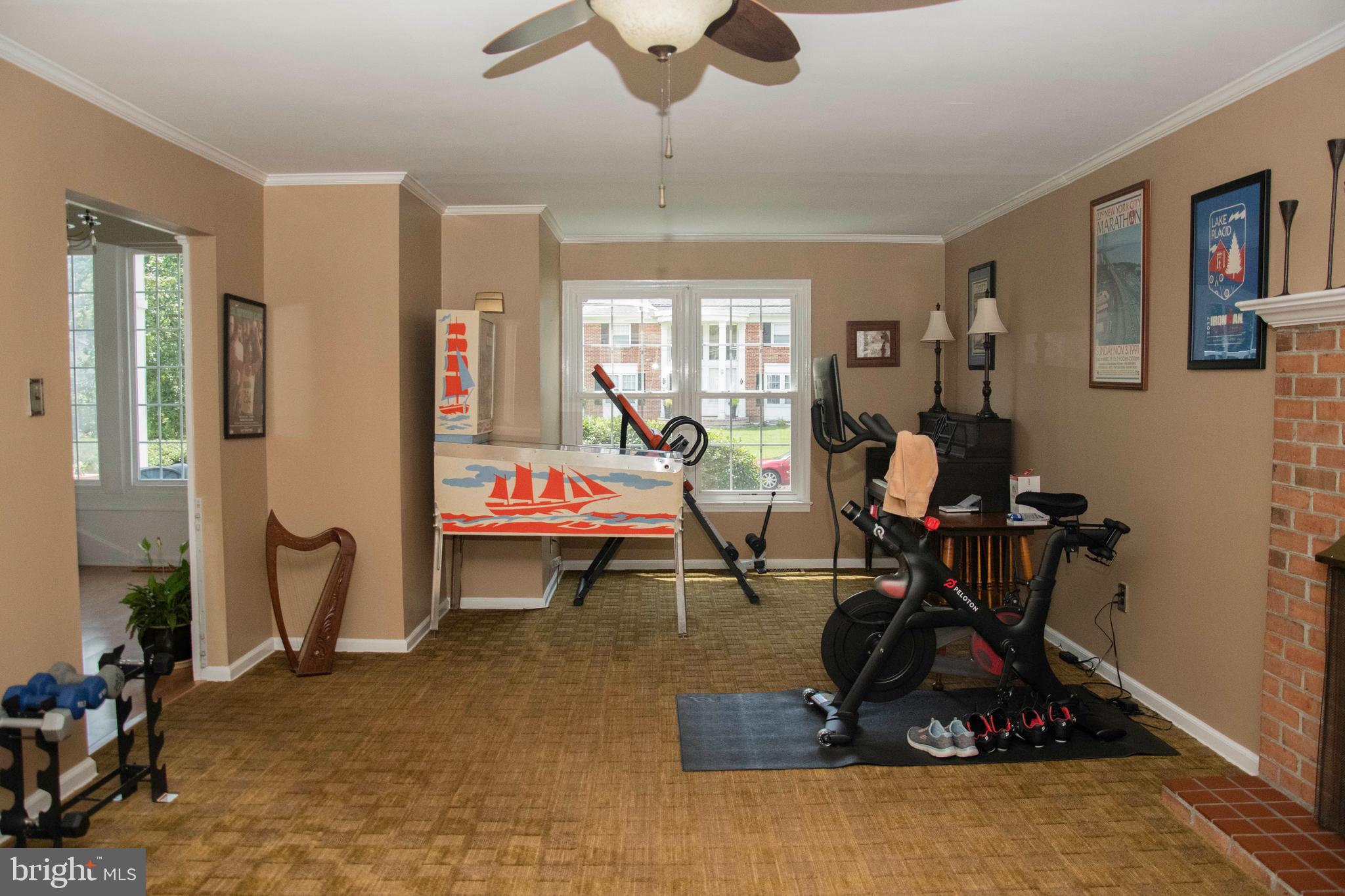 2802 Waterford Drive Cinnaminson, NJ 08077 - Photo 33 of 59 a living room with furniture a window and gym equipment