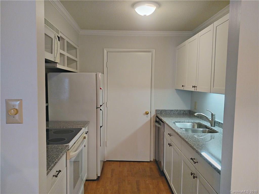 5024 P Sardis Road Charlotte, NC 28270 - Photo 1 of 12 a kitchen with granite countertop a refrigerator and a sink