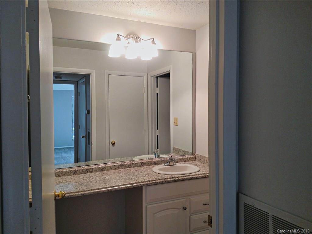 5024 P Sardis Road Charlotte, NC 28270 - Photo 6 of 12 a bathroom with a granite countertop sink and a mirror
