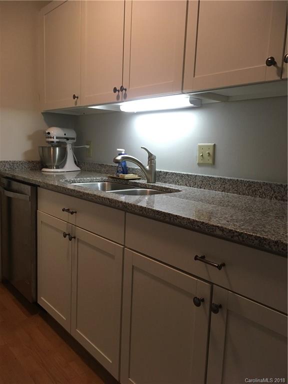 5024 P Sardis Road Charlotte, NC 28270 - Photo 8 of 12 a kitchen with a sink and cabinets