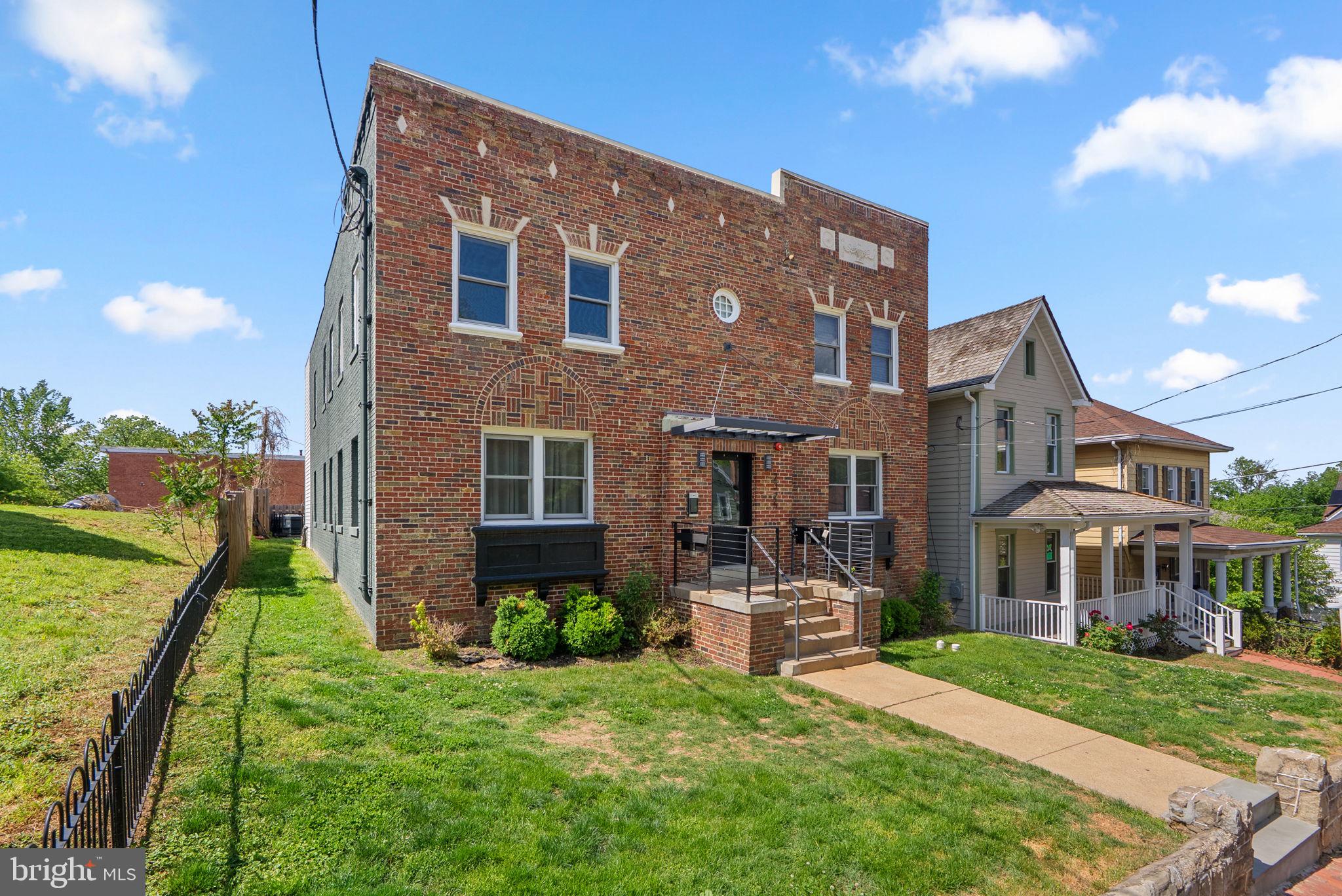 2325 High Street Southeast, Unit 3 Washington, DC 20020 - Photo 1 of 28 a front view of a house with a yard