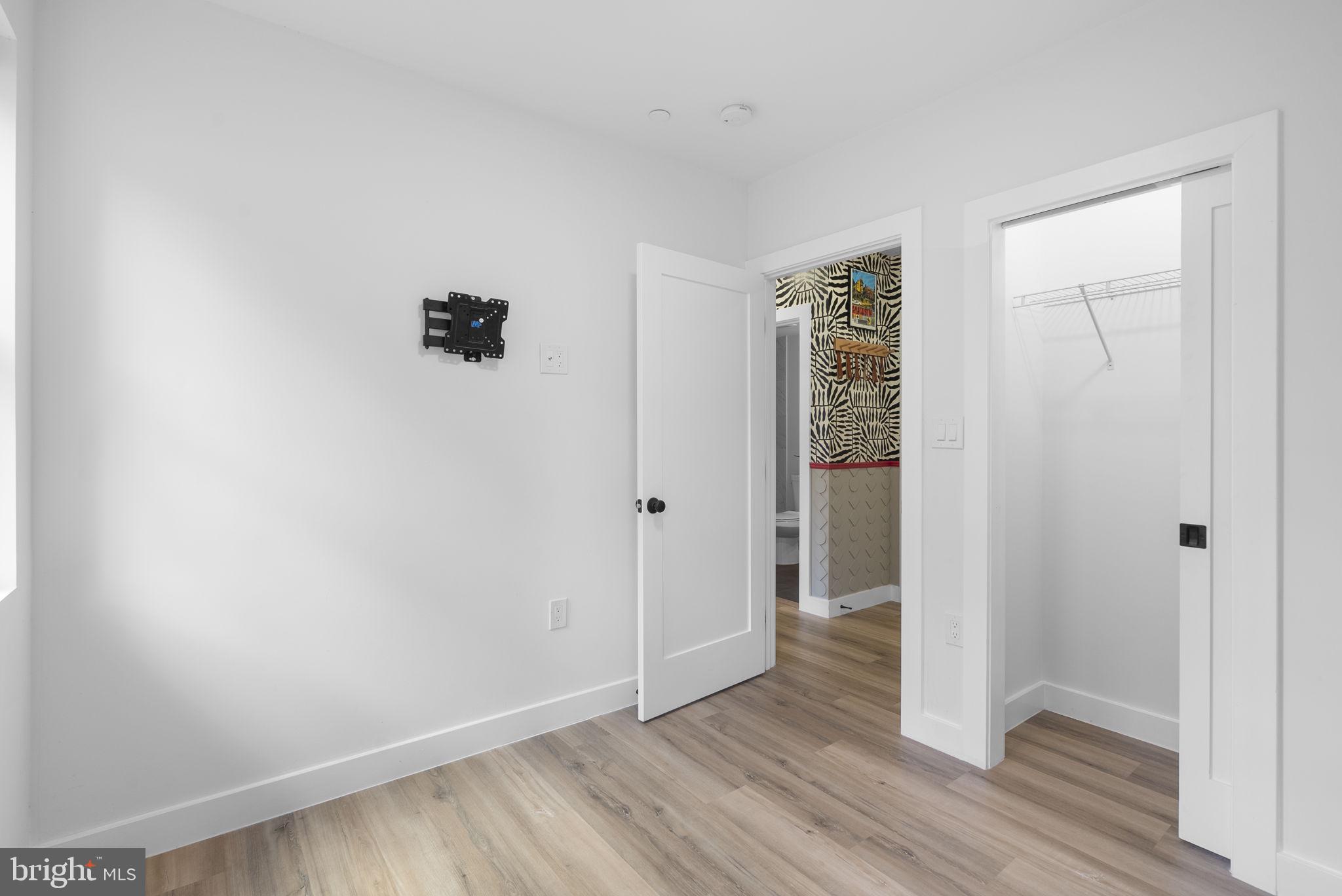 2325 High Street Southeast, Unit 3 Washington, DC 20020 - Photo 16 of 28 a view of an empty room with closet and wooden floor