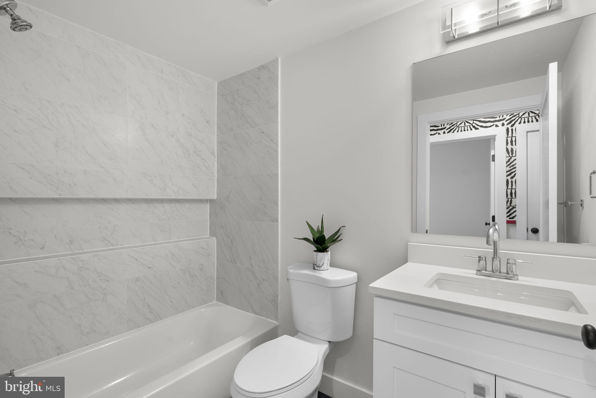 2325 High Street Southeast, Unit 3 Washington, DC 20020 - Photo 19 of 28 a bathroom with a sink toilet and shower