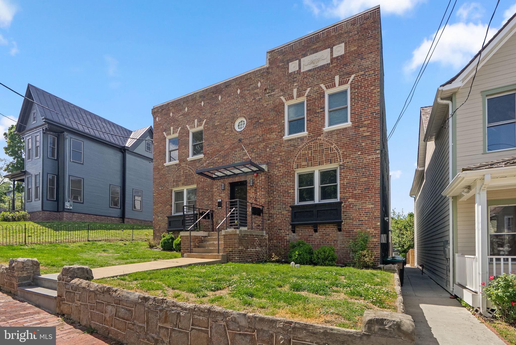 2325 High Street Southeast, Unit 3 Washington, DC 20020 - Photo 2 of 28 a front view of a house with a yard