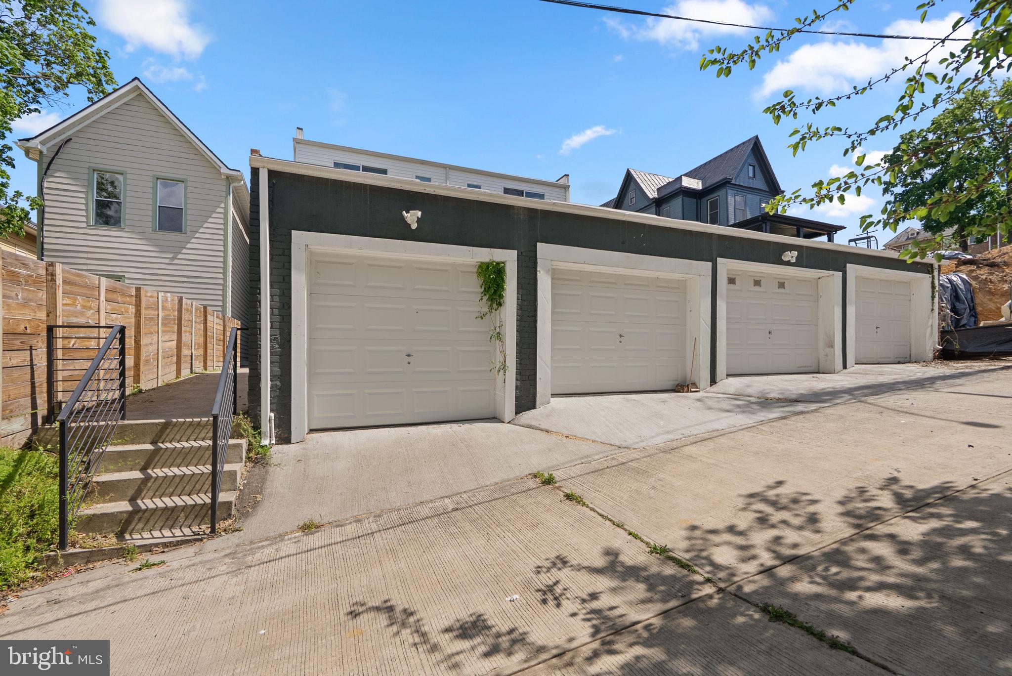 2325 High Street Southeast, Unit 3 Washington, DC 20020 - Photo 27 of 28 a front view of a house with a garage