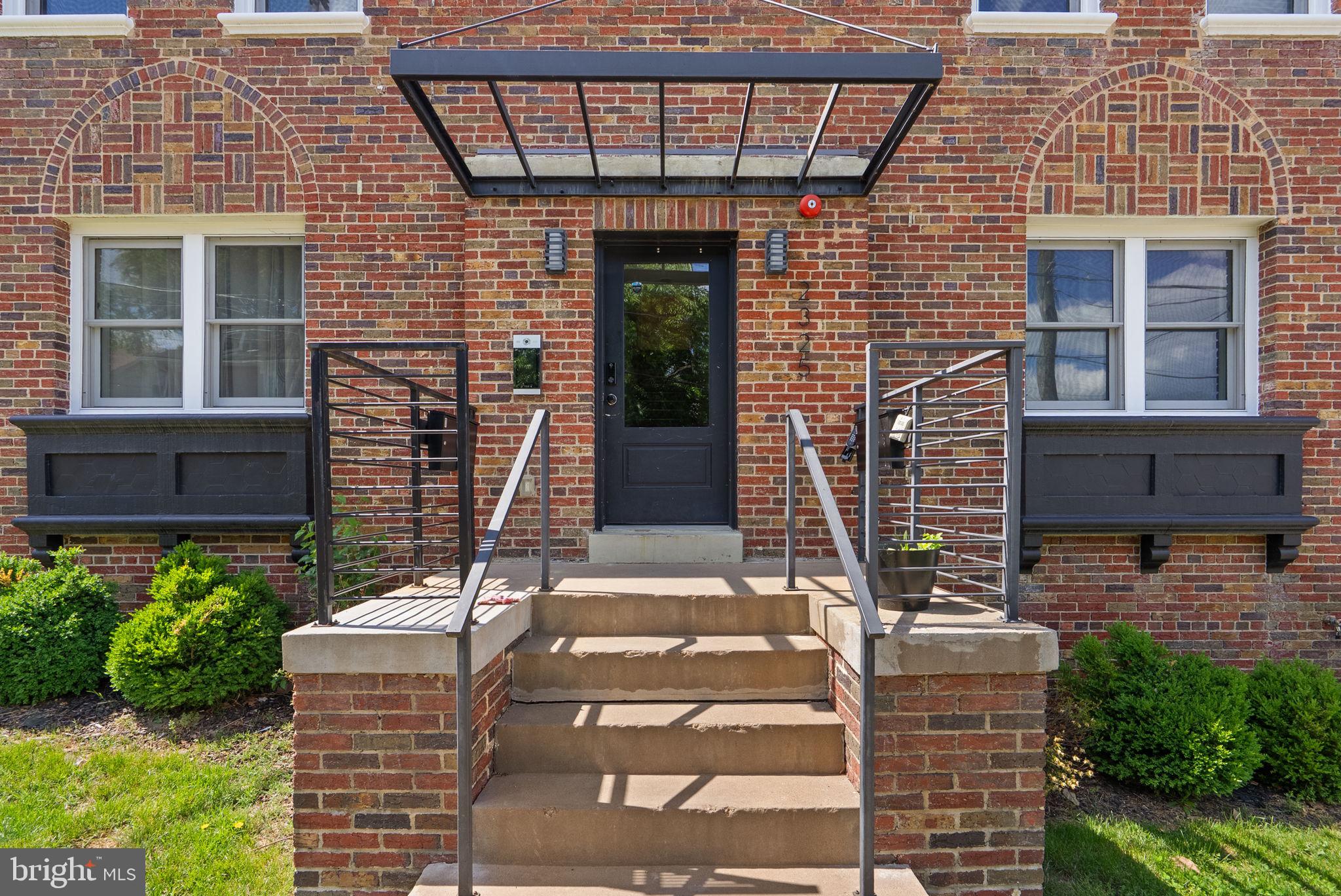 2325 High Street Southeast, Unit 3 Washington, DC 20020 - Photo 3 of 28 a front view of a house with a garden