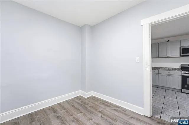 a view of a kitchen with a stove top oven