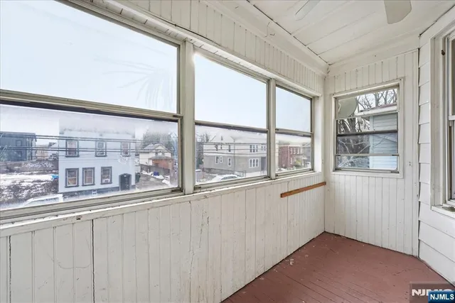 a view of a kitchen with a large window