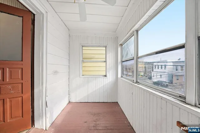 a view of a living room with windows