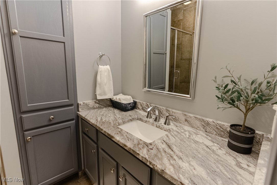 5645 Clingan Road, Unit 23B Struthers, OH 44471 - Photo 23 of 38 Full bath with vanity and a shower stall