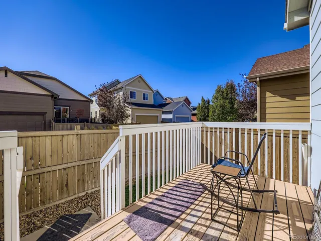 a view of a balcony with wooden floor